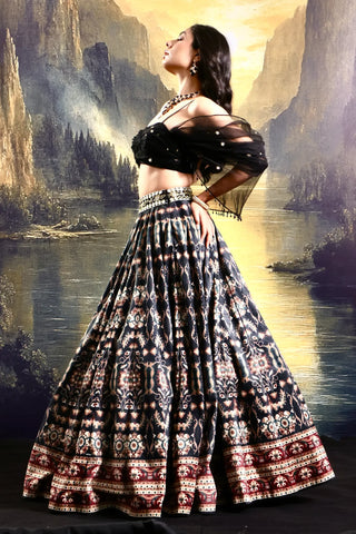 Black printed suede lehenga with a pleated embroidered blouse
