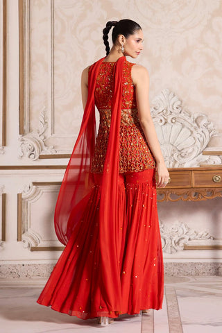 Peplum Sharara Set for Indian Weddings – Orange Cutwork Ensemble by Sanya Gulati