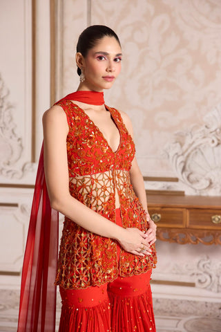 Peplum Sharara Set for Indian Weddings – Orange Cutwork Ensemble by Sanya Gulati