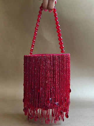 Red glamorous embellished potli with swaying tassels