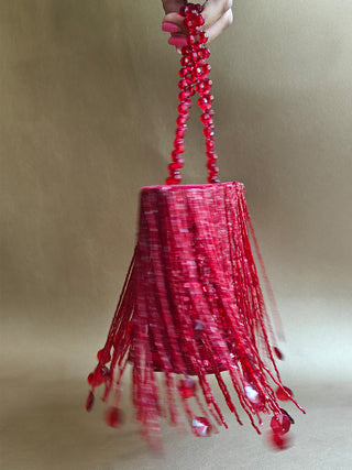 Red glamorous embellished potli with swaying tassels