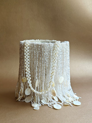 White embellished potli with tassels and shimmer