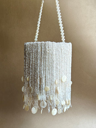White embellished potli with tassels and shimmer