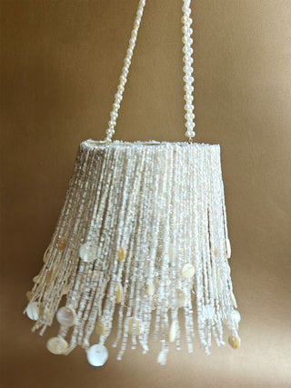 White embellished potli with tassels and shimmer