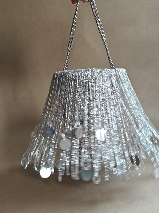 Silver embellished potli with tassels and sparkle
