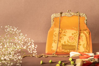 Rust orange vinyl potli clutch