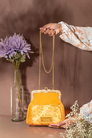 Rust orange vinyl potli clutch