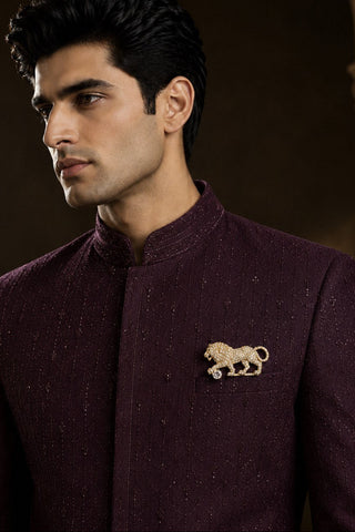 On-model view of the gold zircon lion brooch by Vivinia by Vidhi Mehra worn with a plum sherwani at Mrs. G