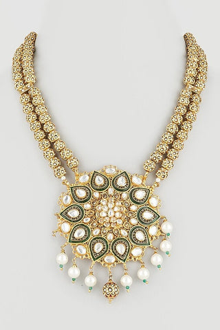Flat product view of the gold kundan floral pendant necklace with pearl drops showing floral pendant with teardrop and pearl drops at Mrs. G
