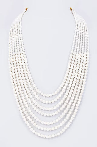 Flat product view of the white multi-layer pearl groom mala showing plain pearls with no metalwork at Mrs. G