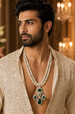 On-model view of the white pearl necklace with green stone pendant by Vivinia by Vidhi Mehra worn with a beige embroidered kurta at Mrs. G