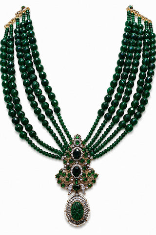 Flat product view of the emerald green multi-layer beaded pendant necklace showing pendant of green stones and zircon accents at Mrs. G