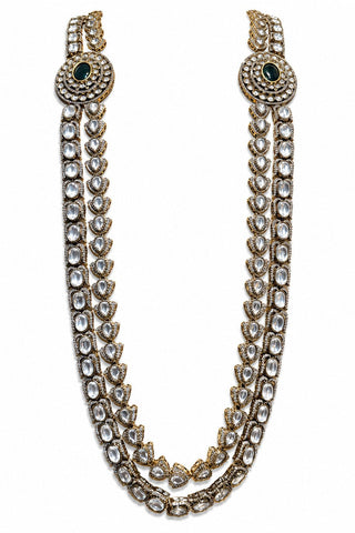 Flat product view of the ivory double-layer kundan necklace with green centers showing circular motifs with deep green center stones at Mrs. G