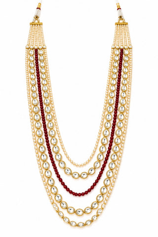 Flat product view of the white and ruby red layered kundan pearl mala showing kundan-style stones in gold-plated settings at Mrs. G