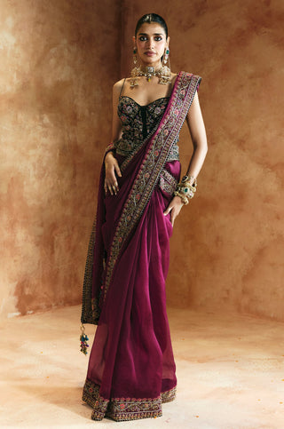 Full-length front view of the magenta saree with black corset blouse and floral embroidered pallu by Aman Takyar at Mrs. G