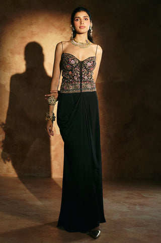 Full-length front view of the black corset set with embroidered corset and draped skirt by Aman Takyar at Mrs. G