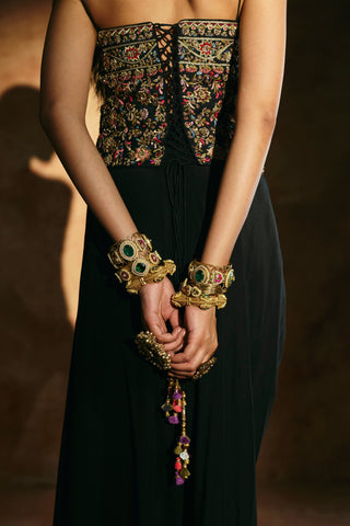 Close-up back view of the black corset set showing the embroidered lace-up back and tasseled ties by Aman Takyar at Mrs. G