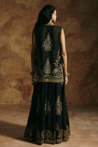 Back view of the black jacket with a large embroidered motif between the shoulders by Aman Takyar at Mrs. G