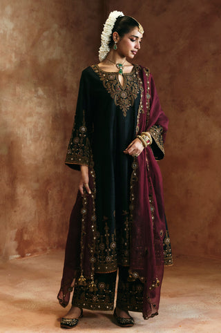Full-length front view of the black keyhole kurta set with wine dupatta and embroidered pants by Aman Takyar at Mrs. G