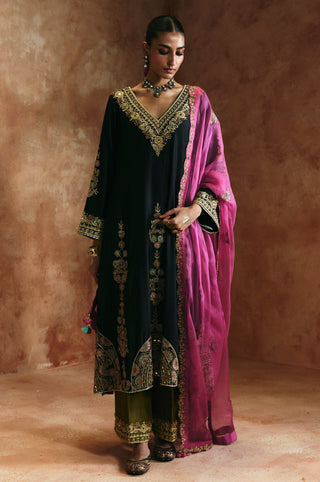 Full-length front view of the black v-neck kurta set with olive pants and pink dupatta by Aman Takyar at Mrs. G