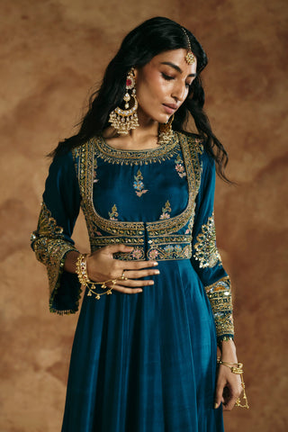 Waist-up close-up of the teal blue anarkali neckline and embroidered bell sleeve by Aman Takyar at Mrs. G