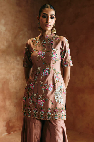 Waist-up front view of the bronze sharara set showing the high neck and floral hem border by Aman Takyar at Mrs. G