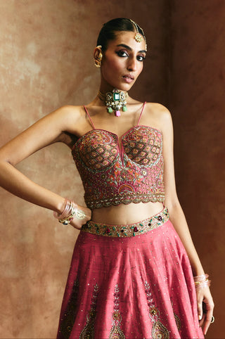 Waist-up view of the carrot pink sweetheart blouse's lattice embroidery and the jeweled waistband by Aman Takyar at Mrs. G