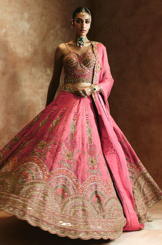 Twirling view of the carrot pink lehenga with the scalloped hem band and dupatta in motion by Aman Takyar at Mrs. G