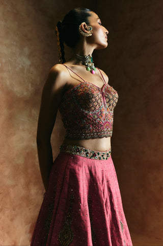 Profile view of the carrot pink blouse with thin straps and the jeweled waistband by Aman Takyar at Mrs. G