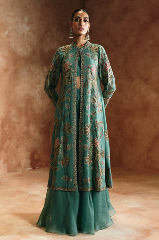 Full-length front view of the coral blue jacket set with embroidered long jacket over the flared skirt by Aman Takyar at Mrs. G