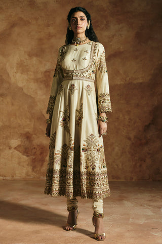 Front view of the ivory anarkali set with a squared embroidered yoke and churidar by Aman Takyar at Mrs. G