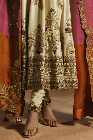 Close-up of the ivory anarkali hem border and the orange and pink dupatta edge by Aman Takyar at Mrs. G