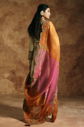 Back-side view of the ivory anarkali with the dupatta draped over the shoulders by Aman Takyar at Mrs. G