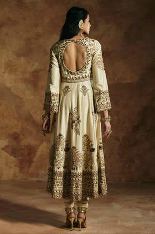 Back view of the ivory anarkali with a rounded cut-out back and embroidered border by Aman Takyar at Mrs. G