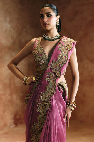 Waist-up close-up of the peach blouse's gold embroidery and the border of the saree by Aman Takyar at Mrs. G