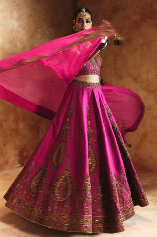 Full-length view of the rani pink lehenga flaring out as the sheer dupatta floats overhead by Aman Takyar at Mrs. G