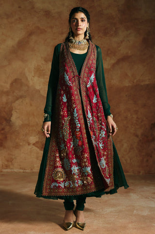 Full-length front view of the red embroidered jacket worn open over the green anarkali by Aman Takyar at Mrs. G