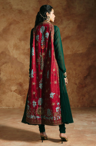 Back view of the red embroidered jacket over the green anarkali by Aman Takyar at Mrs. G