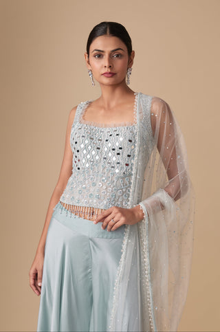 Waist-up view of the square-neck corset blouse with round and diamond mirrors and beaded tassel hem by Asaga at Mrs. G