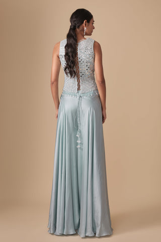 Full-length back view of the corset blouse with diamond lattice back and tasseled cords above the satin sharara by Asaga at Mrs. G