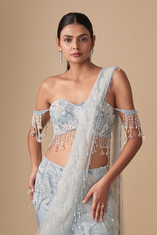 Waist-up view of the off-shoulder blouse with crystal tassel sleeves and the net pallu on one shoulder by Asaga at Mrs. G