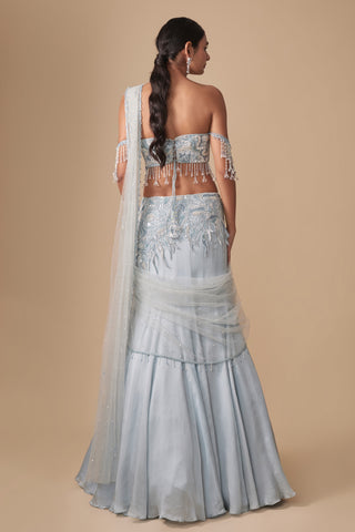 Full-length back view of the lace-up blouse and the fishtail skirt with draped net by Asaga at Mrs. G