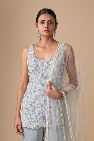 Waist-up view of the scoop-neck kurti with raised pearl and bead flowers and pearl-edged dupatta by Asaga at Mrs. G