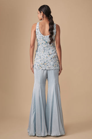 Full-length back view of the baby blue kurti with scooped back and gored satin sharara by Asaga at Mrs. G
