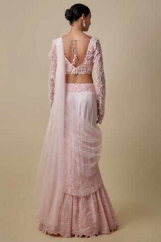Full-length back view of the baby pink scooped-back blouse with a tie and cascading net drape by Asaga at Mrs. G