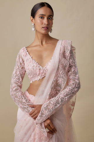 Three-quarter view of the baby pink net drape with an embroidered edge over the full-sleeve blouse by Asaga at Mrs. G