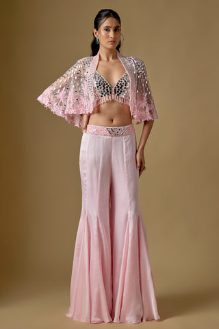 Full-length front view of the baby pink short mirror cape over a mirror blouse and flared satin sharara by Asaga at Mrs. G