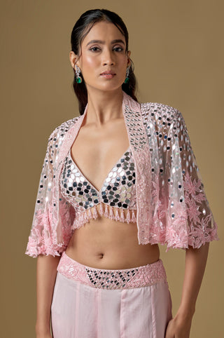 Waist-up close-up of the baby pink mirror bralette with a bead fringe under the open cape by Asaga at Mrs. G