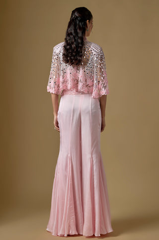 Back view of the baby pink mirror cape with floral cutwork hem over the flared sharara by Asaga at Mrs. G