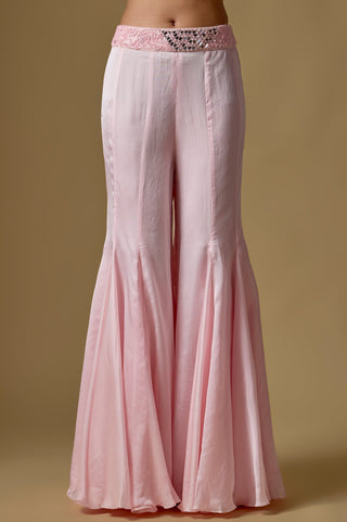 Detail of the baby pink flared satin sharara with a mirror work waistband by Asaga at Mrs. G